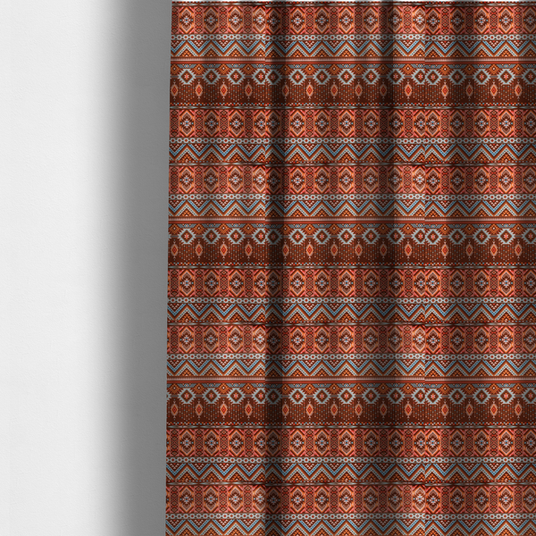 The fabric used to create these made-to-measure curtains is a brown fabric pattern featuring southwest-inspired geometric bands with zigzags, diamonds, and native-style motifs in terracotta, light blue, and cream.