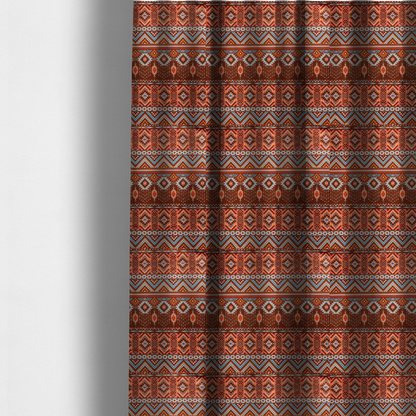 The fabric used to create these made-to-measure curtains is a brown fabric pattern featuring southwest-inspired geometric bands with zigzags, diamonds, and native-style motifs in terracotta, light blue, and cream.