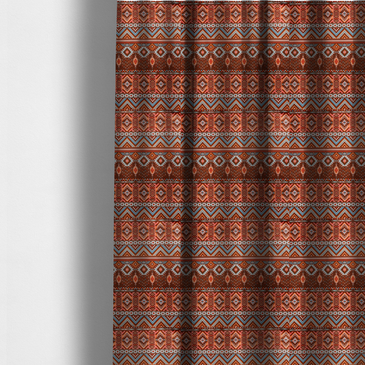 The fabric used to create these made-to-measure curtains is a brown fabric pattern featuring southwest-inspired geometric bands with zigzags, diamonds, and native-style motifs in terracotta, light blue, and cream.
