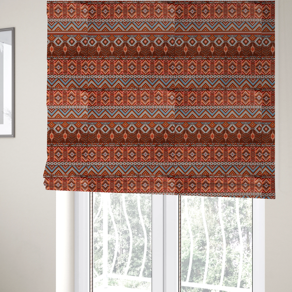 The fabric used to create these Roman blinds is a brown fabric pattern featuring southwest-inspired geometric bands with zigzags, diamonds, and native-style motifs in terracotta, light blue, and cream.