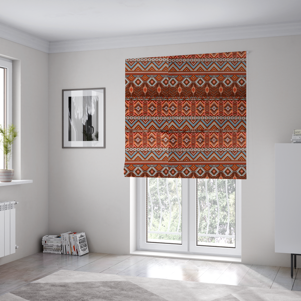 The fabric used to create these Roman blinds is a brown fabric pattern featuring southwest-inspired geometric bands with zigzags, diamonds, and native-style motifs in terracotta, light blue, and cream.
