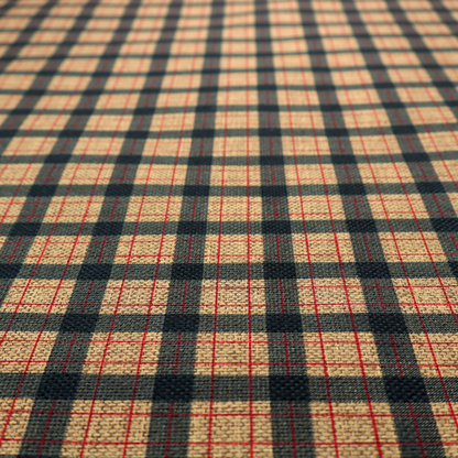 A rustic plaid fabric pattern featuring a grid of intersecting navy blue and tan stripes with thin red accent lines.