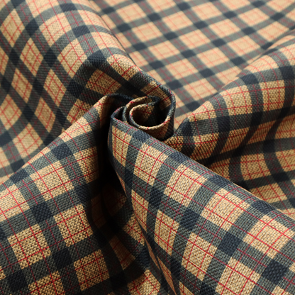 A rustic plaid fabric pattern featuring a grid of intersecting navy blue and tan stripes with thin red accent lines.