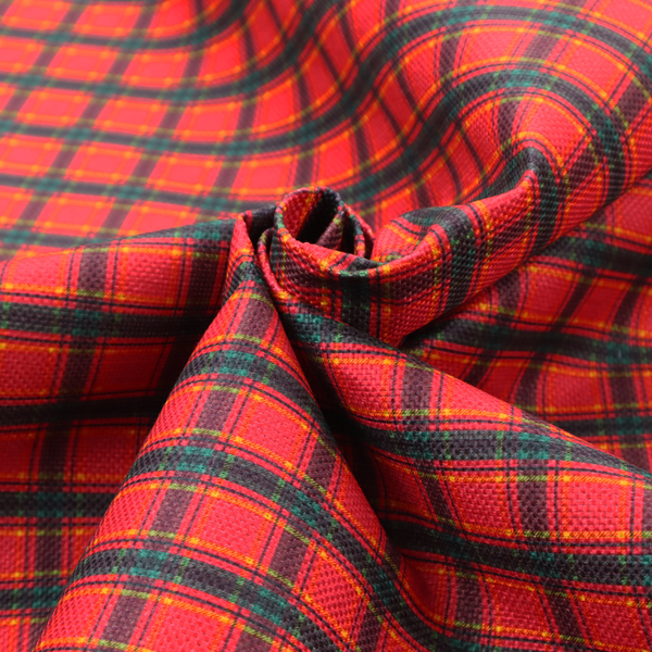 A vibrant red plaid fabric pattern featuring a dense grid of intersecting dark green and thin yellow stripes.