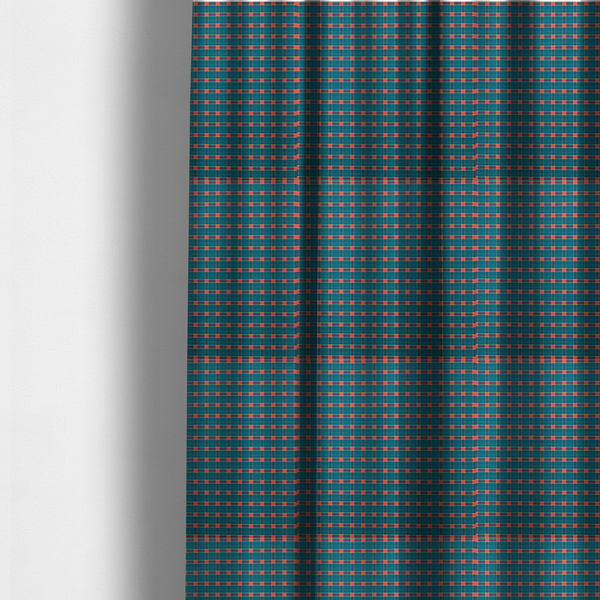 The fabric used to create these made-to-measure curtains is a rich teal plaid fabric pattern featuring a dense grid of intersecting dark blue and thin yellow stripes with bright red square accents.