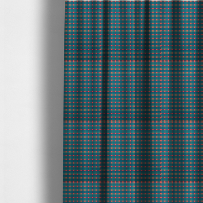 The fabric used to create these made-to-measure curtains is a rich teal plaid fabric pattern featuring a dense grid of intersecting dark blue and thin yellow stripes with bright red square accents.