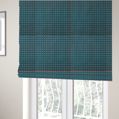 The fabric used to create these Roman blinds is a rich teal plaid fabric pattern featuring a dense grid of intersecting dark blue and thin yellow stripes with bright red square accents.