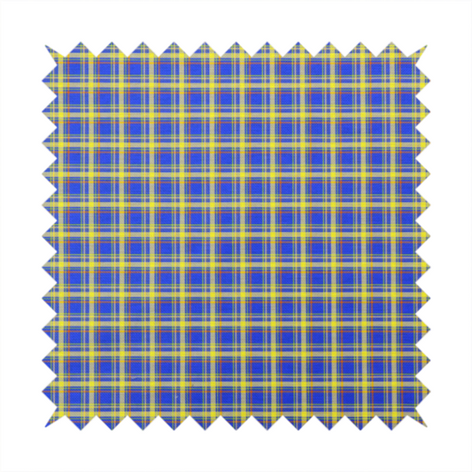 A bright blue plaid fabric pattern featuring a tight, repeating grid of intersecting yellow stripes and thin orange accent lines.