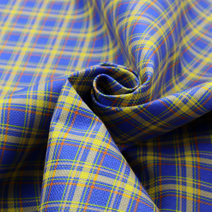 A bright blue plaid fabric pattern featuring a tight, repeating grid of intersecting yellow stripes and thin orange accent lines.