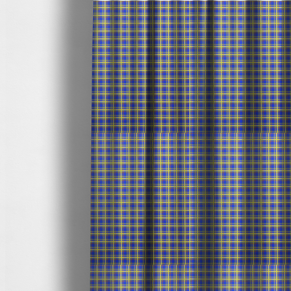 The fabric used to create these made-to-measure curtains is a bright blue plaid fabric pattern featuring a tight, repeating grid of intersecting yellow stripes and thin orange accent lines.