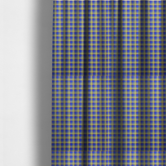 The fabric used to create these made-to-measure curtains is a bright blue plaid fabric pattern featuring a tight, repeating grid of intersecting yellow stripes and thin orange accent lines.