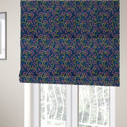 The fabric used to create these Roman blinds is a deep blue fabric pattern featuring a winding trail of bright yellow vines accented with clusters of pink and white flowers and blue fern leaves.