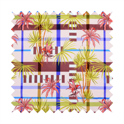 An eclectic, geometric tropical fabric pattern featuring a unique overlay design. The background is a structured windowpane plaid layout composed of intersecting lines in cobalt blue, olive green, and chocolate brown across a dusty pink base. Layered over this grid is a repeating botanical print of tropical plants, featuring fan palms in lime green and slender fronds in terracotta pink.
