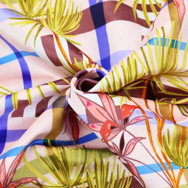 An eclectic, geometric tropical fabric pattern featuring a unique overlay design. The background is a structured windowpane plaid layout composed of intersecting lines in cobalt blue, olive green, and chocolate brown across a dusty pink base. Layered over this grid is a repeating botanical print of tropical plants, featuring fan palms in lime green and slender fronds in terracotta pink.