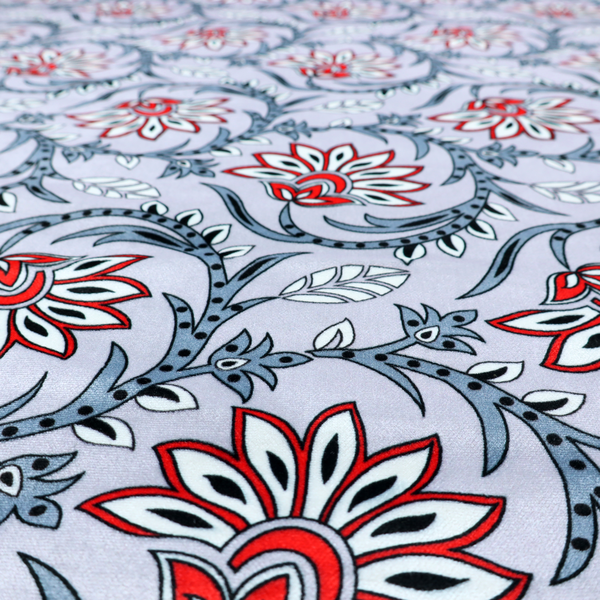An ornate, traditional Kalamkari-style pattern of swirling grey vines and large lotus-like flowers with red and white petals on a light grey background.