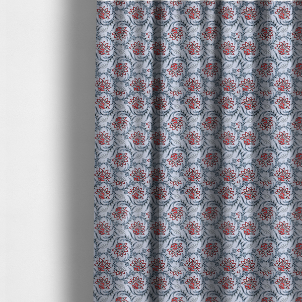 The fabric used to create these made-to-measure curtains is a ornate, traditional Kalamkari-style pattern of swirling grey vines and large lotus-like flowers with red and white petals on a light grey background.