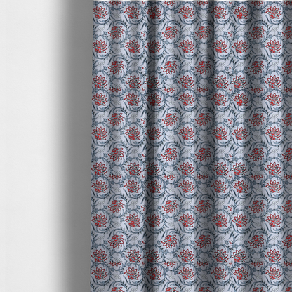 The fabric used to create these made-to-measure curtains is a ornate, traditional Kalamkari-style pattern of swirling grey vines and large lotus-like flowers with red and white petals on a light grey background.