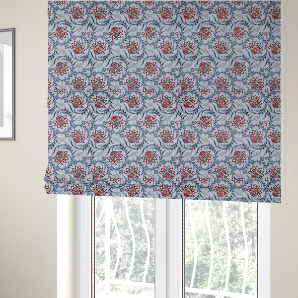 The fabric used to create these Roman blinds is a ornate, traditional Kalamkari-style pattern of swirling grey vines and large lotus-like flowers with red and white petals on a light grey background.