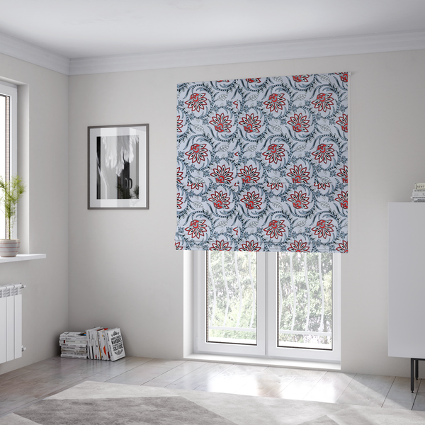 The fabric used to create these Roman blinds is a ornate, traditional Kalamkari-style pattern of swirling grey vines and large lotus-like flowers with red and white petals on a light grey background.