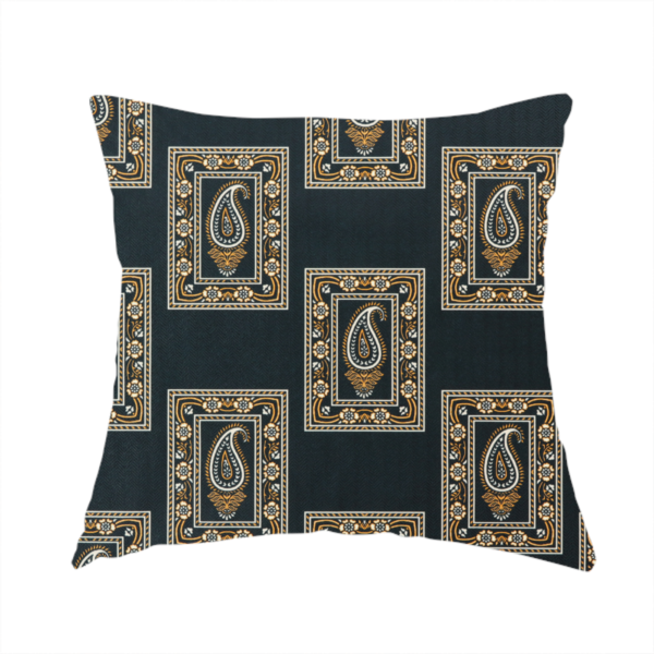 The fabric used to create this handmade cushion is a featuring a traditional repeating pattern of detailed white and gold paisley motifs, each enclosed within an ornate rectangular border on a charcoal black background.