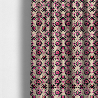 The fabric used to create these made-to-measure curtains is a featuring a vibrant bohemian Suzani-style pattern with bold hot pink and black floral medallions arranged in a diamond lattice on a cream background.