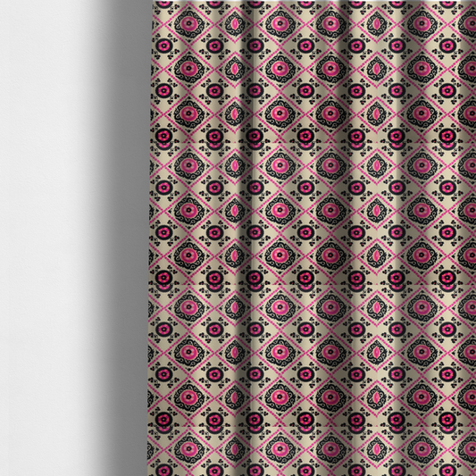 The fabric used to create these made-to-measure curtains is a featuring a vibrant bohemian Suzani-style pattern with bold hot pink and black floral medallions arranged in a diamond lattice on a cream background.