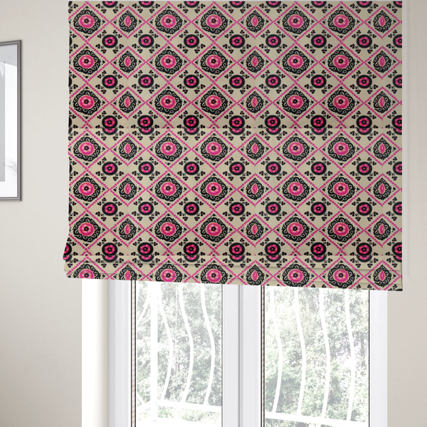 The fabric used to create these Roman blinds is a featuring a vibrant bohemian Suzani-style pattern with bold hot pink and black floral medallions arranged in a diamond lattice on a cream background.