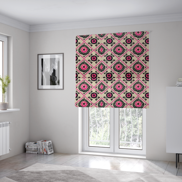 The fabric used to create these Roman blinds is a featuring a vibrant bohemian Suzani-style pattern with bold hot pink and black floral medallions arranged in a diamond lattice on a cream background.