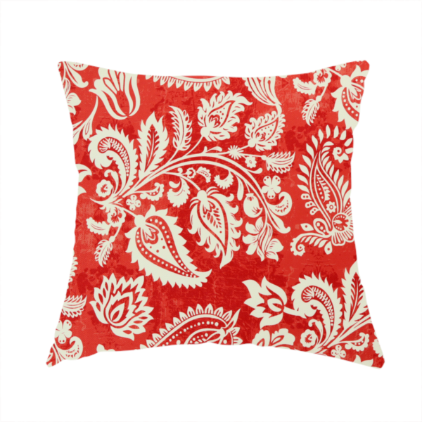 The fabric used to create this handmade cushion is a featuring an ornate repeating pattern of elegant ivory paisley motifs and botanical flourishes over a textured, mottled crimson red background.