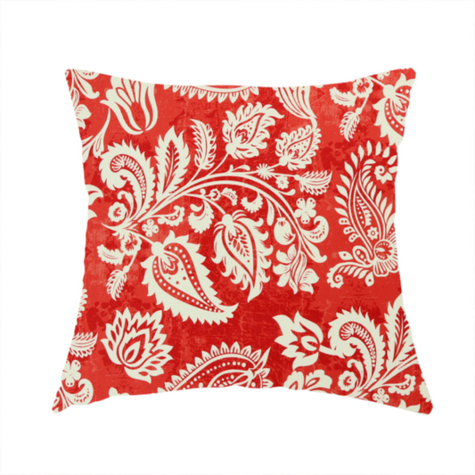 The fabric used to create this handmade cushion is a featuring an ornate repeating pattern of elegant ivory paisley motifs and botanical flourishes over a textured, mottled crimson red background.