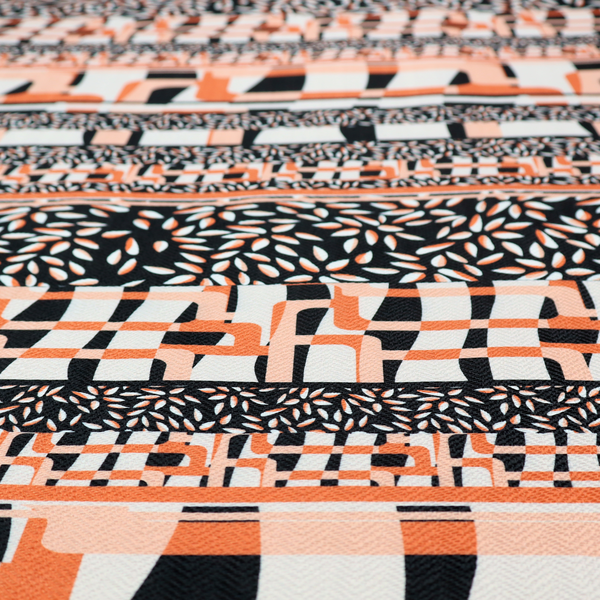 Fabric featuring a bold, multi-patterned horizontal striped design with alternating bands of geometric coral and cream blocks and dense black-and-white micro leaf speckles.