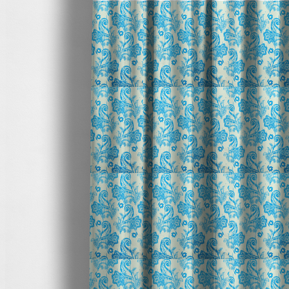 The fabric used to create these made-to-measure curtains is a bohemian-style textile featuring a bold ikat paisley pattern printed against a crisp off-white backdrop. The repeating motif showcases large, ornate teardrop paisley swirls integrated with stylized damask flowers.