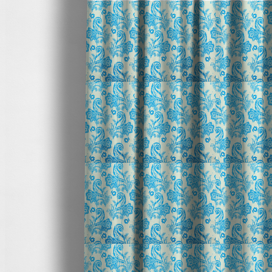 The fabric used to create these made-to-measure curtains is a bohemian-style textile featuring a bold ikat paisley pattern printed against a crisp off-white backdrop. The repeating motif showcases large, ornate teardrop paisley swirls integrated with stylized damask flowers.