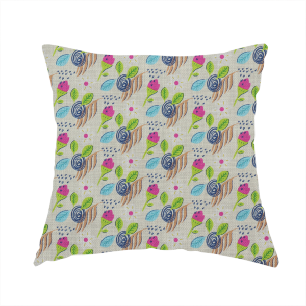 The fabric used to create this handmade cushion is a featuring a whimsical, hand-drawn botanical pattern of small pink flower buds, blue spiral circles, and bright green leaves on a light grey linen-textured background.