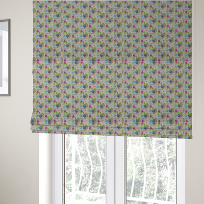 The fabric used to create these Roman blinds is a featuring a whimsical, hand-drawn botanical pattern of small pink flower buds, blue spiral circles, and bright green leaves on a light grey linen-textured background.