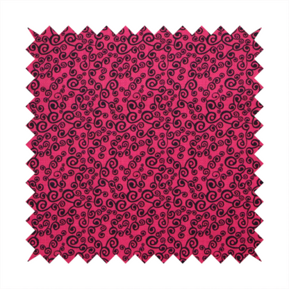 Fabric featuring a dense, repeating abstract pattern of intricate black swirls, scrolls, and curly tendrils tightly packed across a vibrant magenta pink background.