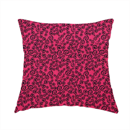 The fabric used to create this handmade cushion is a featuring a dense, repeating abstract pattern of intricate black swirls, scrolls, and curly tendrils tightly packed across a vibrant magenta pink background.