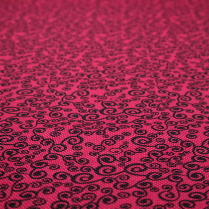 Fabric featuring a dense, repeating abstract pattern of intricate black swirls, scrolls, and curly tendrils tightly packed across a vibrant magenta pink background.