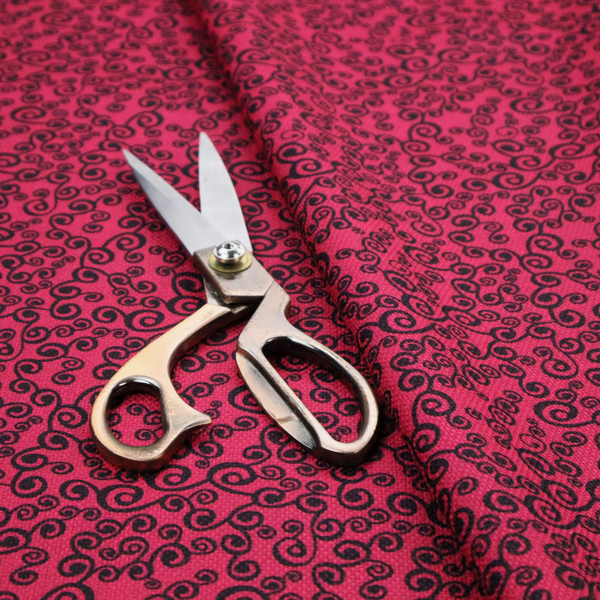 Fabric featuring a dense, repeating abstract pattern of intricate black swirls, scrolls, and curly tendrils tightly packed across a vibrant magenta pink background.