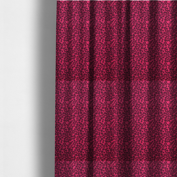 The fabric used to create these made-to-measure curtains is a featuring a dense, repeating abstract pattern of intricate black swirls, scrolls, and curly tendrils tightly packed across a vibrant magenta pink background.