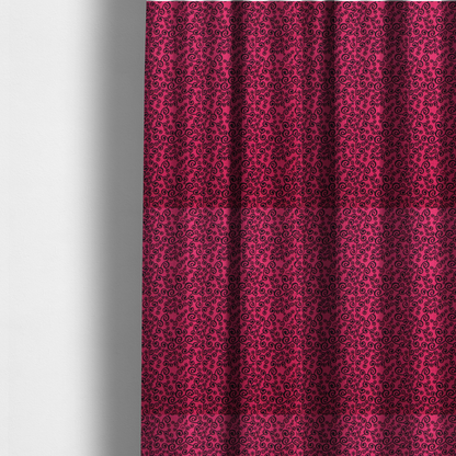 The fabric used to create these made-to-measure curtains is a featuring a dense, repeating abstract pattern of intricate black swirls, scrolls, and curly tendrils tightly packed across a vibrant magenta pink background.