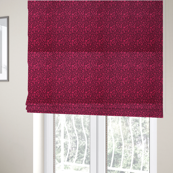 The fabric used to create these Roman blinds is a featuring a dense, repeating abstract pattern of intricate black swirls, scrolls, and curly tendrils tightly packed across a vibrant magenta pink background.