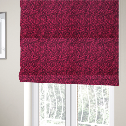 The fabric used to create these Roman blinds is a featuring a dense, repeating abstract pattern of intricate black swirls, scrolls, and curly tendrils tightly packed across a vibrant magenta pink background.