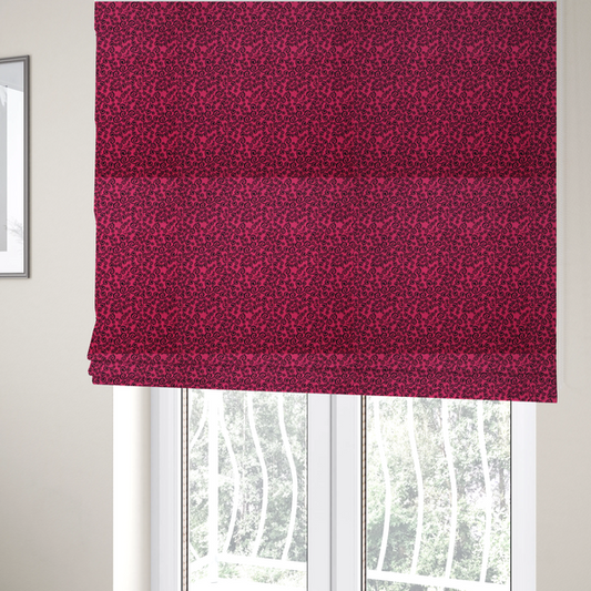 The fabric used to create these Roman blinds is a featuring a dense, repeating abstract pattern of intricate black swirls, scrolls, and curly tendrils tightly packed across a vibrant magenta pink background.