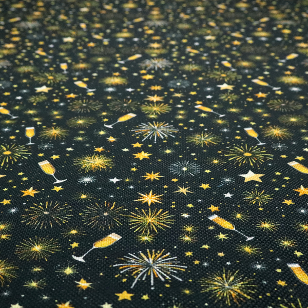 Fabric featuring a festive celebration print with an all-over micro pattern of golden champagne glasses, bursting fireworks, and twinkling stars on a deep black background.