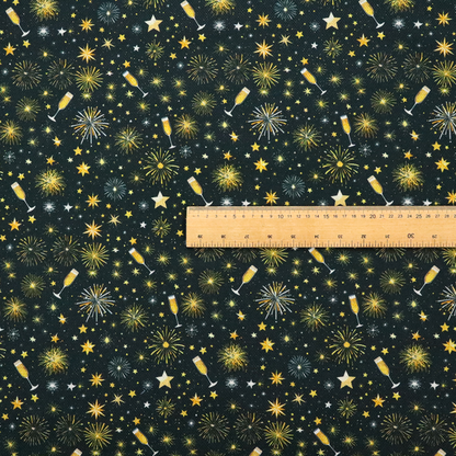 Fabric featuring a festive celebration print with an all-over micro pattern of golden champagne glasses, bursting fireworks, and twinkling stars on a deep black background.