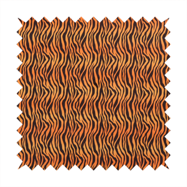Fabric featuring a dense, repeating animal print pattern of vertical black tiger stripes over a vibrant orange background.