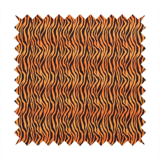 Fabric featuring a dense, repeating animal print pattern of vertical black tiger stripes over a vibrant orange background.