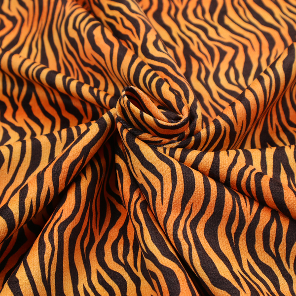 Fabric featuring a dense, repeating animal print pattern of vertical black tiger stripes over a vibrant orange background.