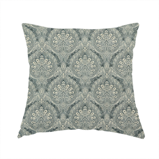 The fabric used to create this handmade cushion is a intricate, repeating damask and paisley design.
